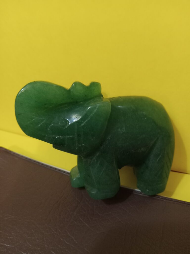 A jade elephant embodying the idea of eating an elephant one bite at a time.